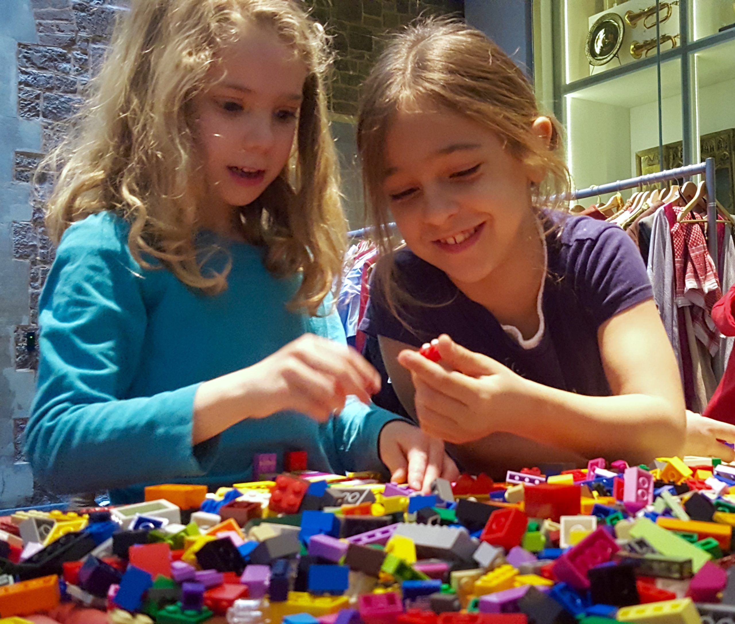 Two girls playing with Lego