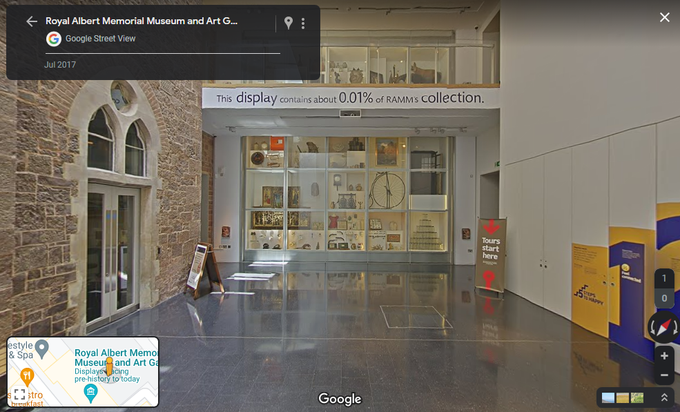 A screenshot of RAMM courtyard as it can be seen on Google Streetview. The image shows the courtyard wall at RAMM, full of different objects, plus the screen of Google street viewer