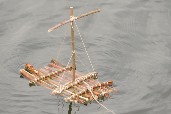 Photo of a small model raft made out of wood