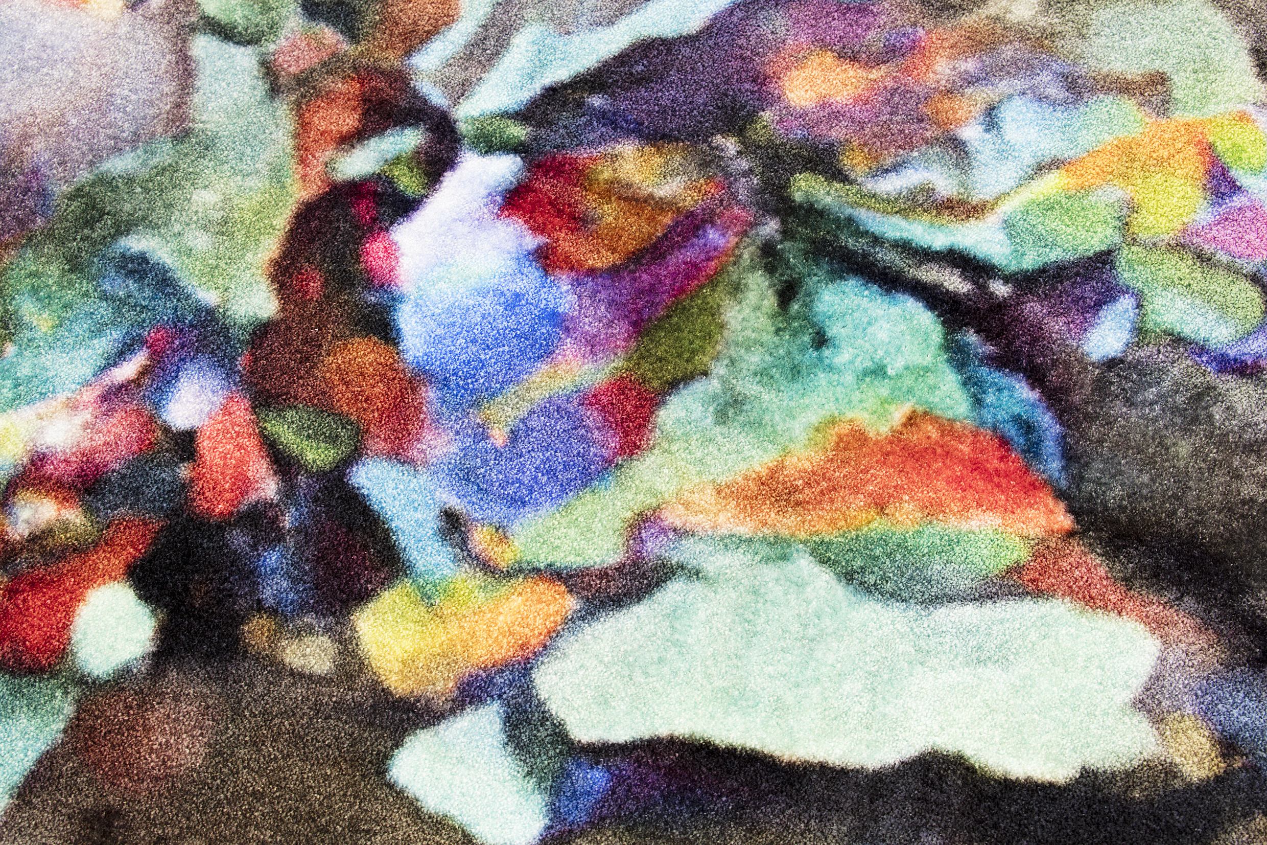 a close-up of the multicoloured shapes in the carpet