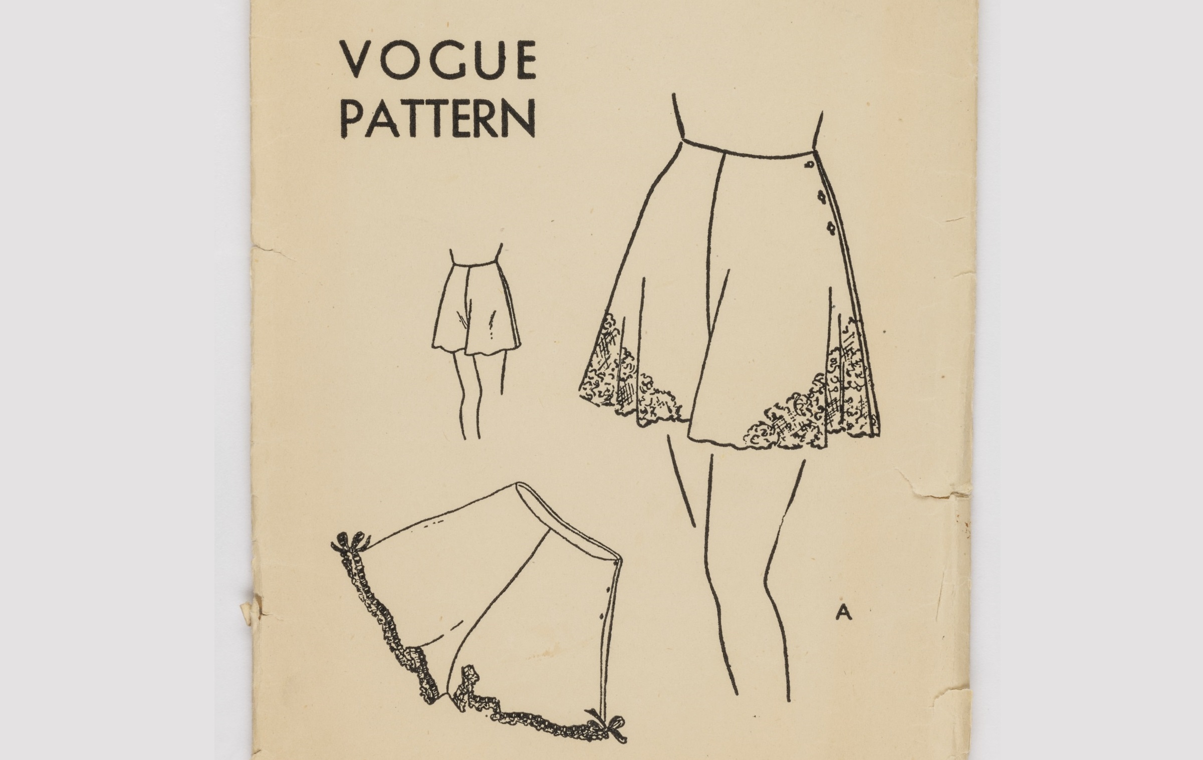 close up of a cover of a 1940s pattern magazine showing a line drawing of someone wearing long shorts